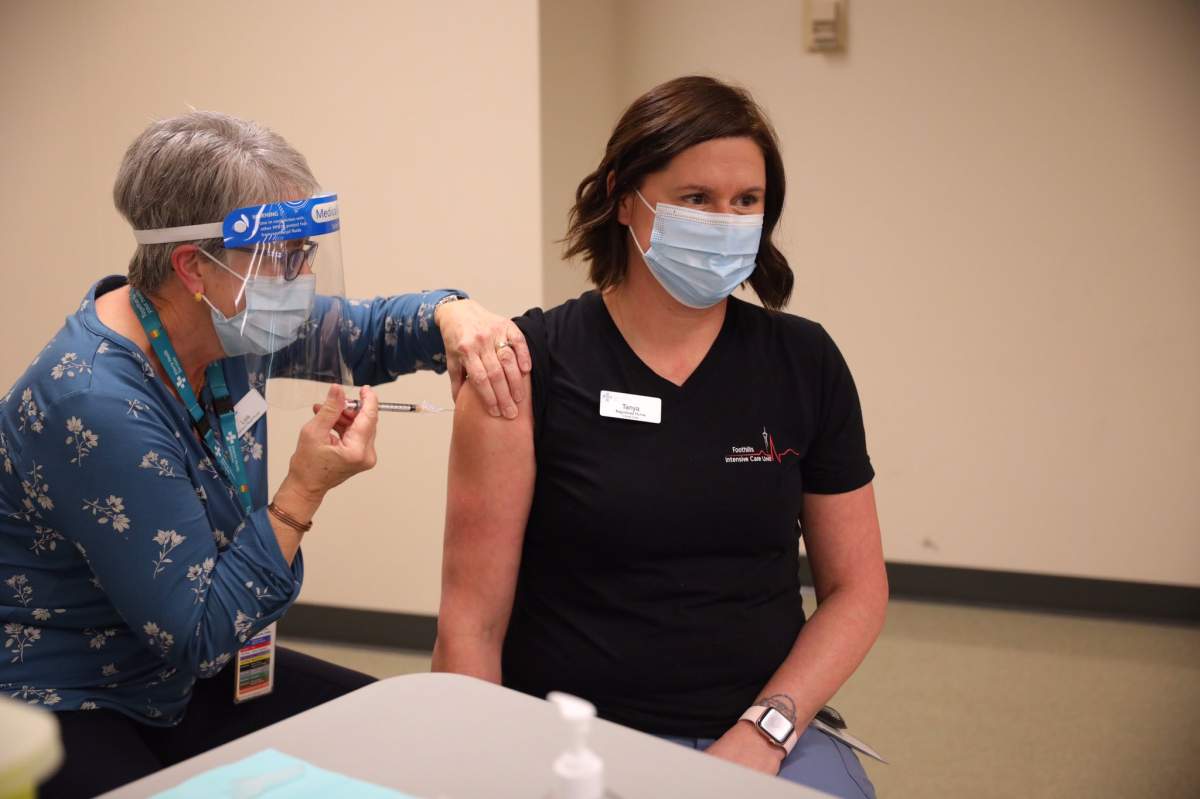 Registered Nurse Tanya Harvey was one of the first Albertans to receive the Pfizer-BioNTech Covid-19 vaccine in Calgary, Alta. on Tuesday, December 15, 2020.