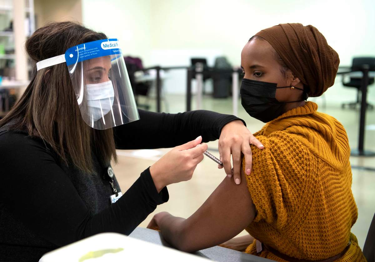 Respiratory therapist Sahra Kaahiye became the first Albertan to receive the Pfizer-BioNTech COVID-19 vaccine in Edmonton, Alta. on Tuesday, December 15, 2020.