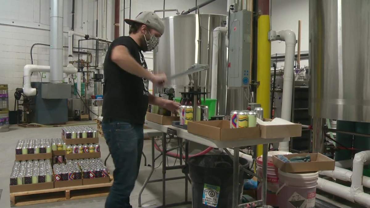Cans of beer being packaged at Analog Brewing in Edmonton, Alta.