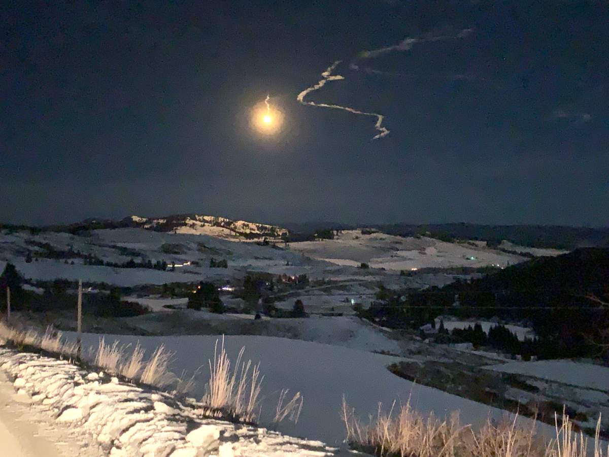 A flare lights up the area where a B.C. RCMP officer and a suspect were trapped in a ravine on Tuesday night.
