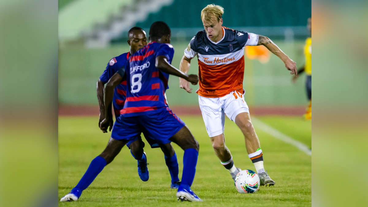 Forge FC Captain Kyle Bekker attempts to allude to players from Haiti's Arcahaie FC in Scotiabank Champions League quarterfinal play Tuesday Dec.1 , 2020.