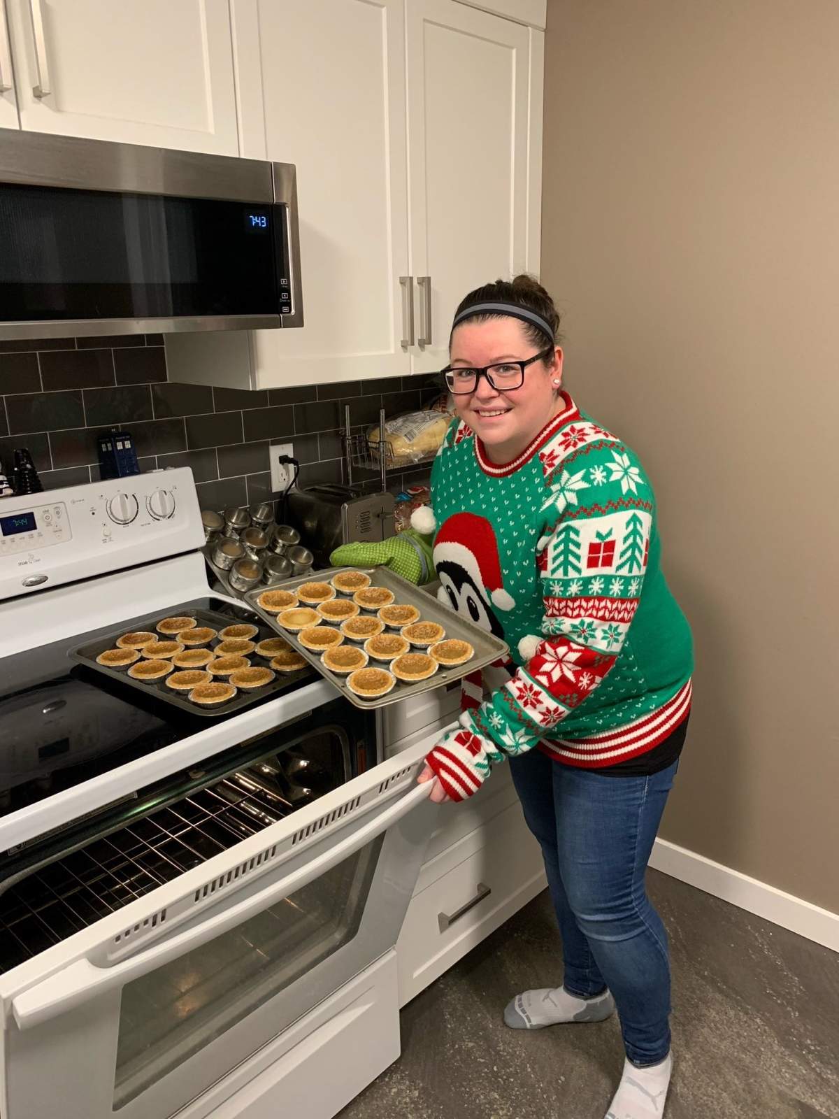 Nicole Brydges baking butter tarts to pass along to a community member.