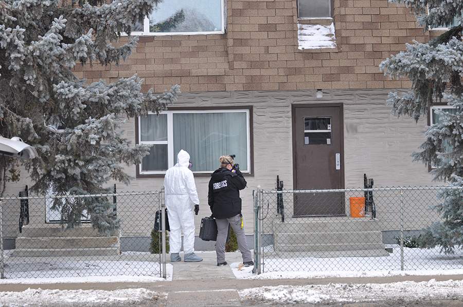 Police outside Bud Paul's residence.