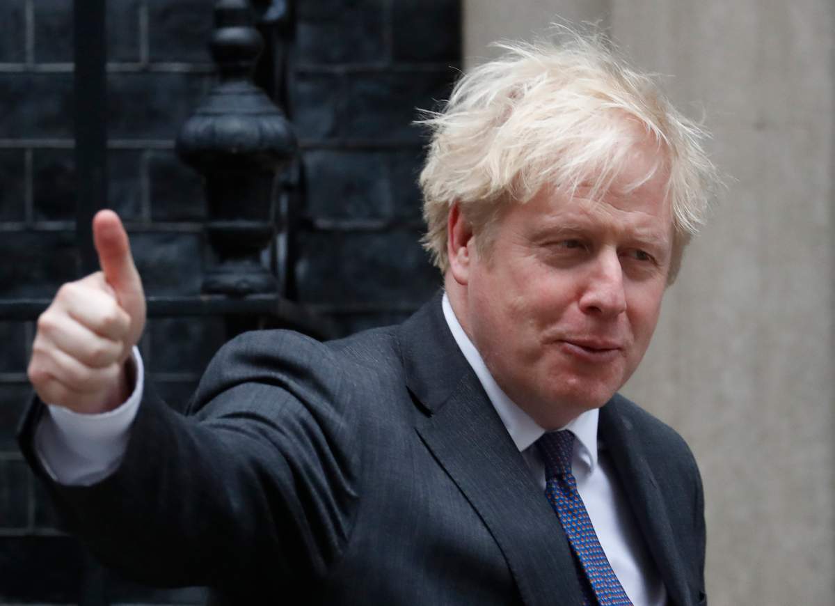 Britain's Prime Minister Boris Johnson shows a thumb up as he welcomes the Crown Prince of the Emirate of Abu Dhabi, Sheikh Mohammed bin Zayed Al Nahyan at 10 Downing Street in London, Thursday, Dec. 10, 2020.