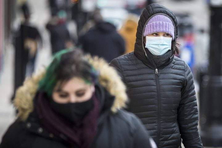 A person wears a disposable mask in Kingston, Ontario on Wednesday, December 16, 2020, as the COVID-19 pandemic continues across Canada and around the world.