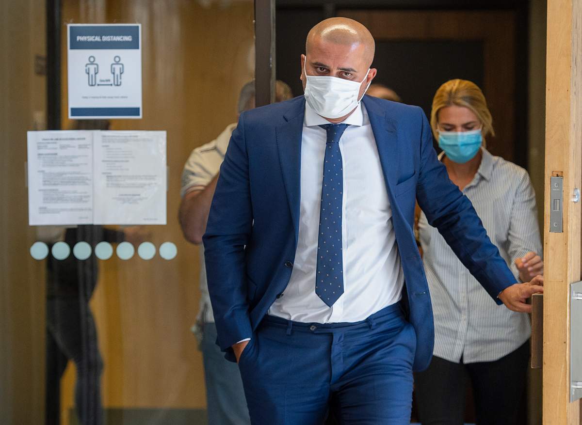 Bassam Al-Rawi, convicted of sexually assaulting a woman in December 2012 after he picked her up in his cab, heads from Nova Scotia Supreme Court after being released to a surety in Halifax on Friday, Aug. 28, 2020. 