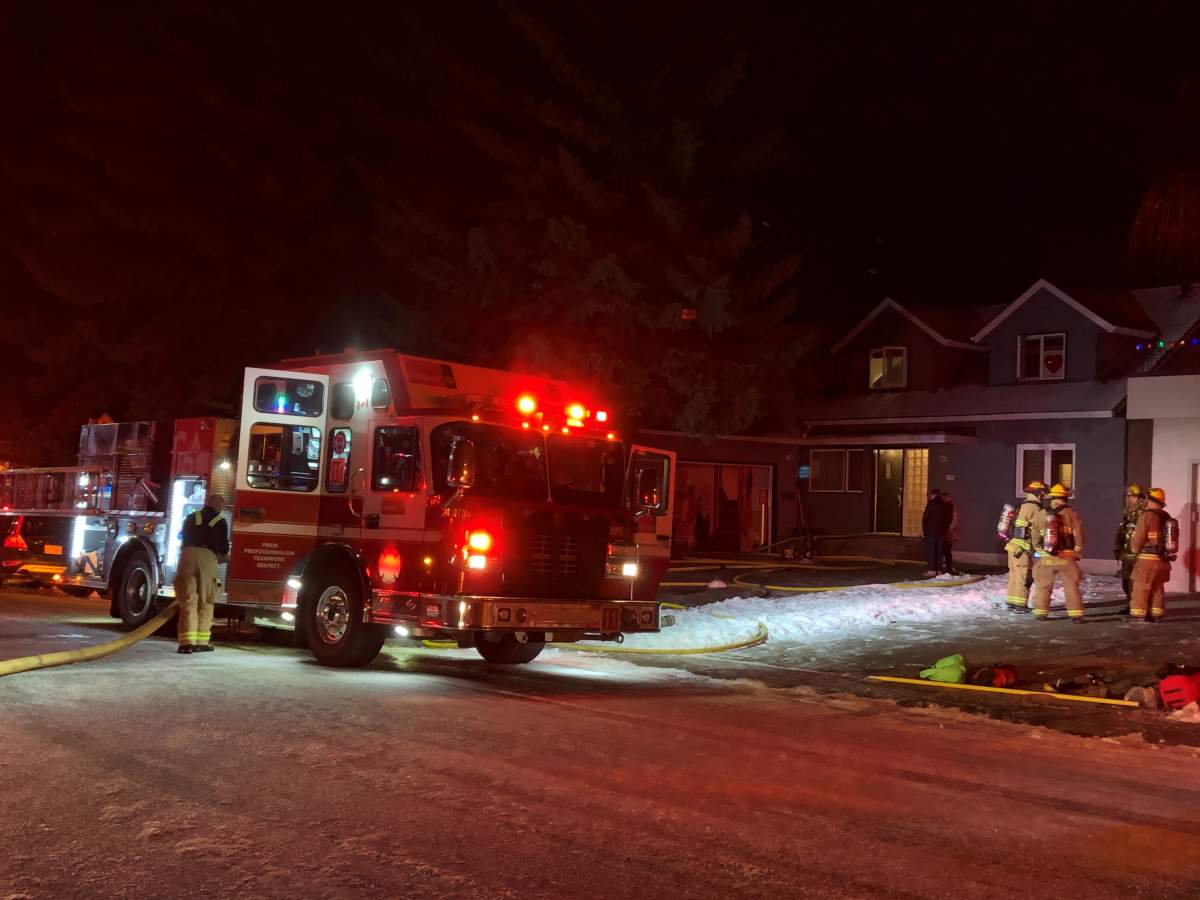 Crews respond to a house fire in Calgary Tuesday, Dec. 15, 2020. 