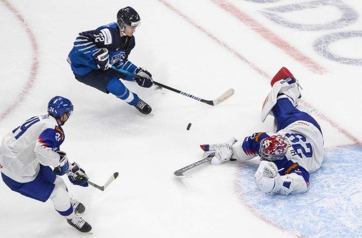 Finland’s Roni Hirvonen (22) is stopped by Slovakia’s goalie Samuel Hlavaj (29) as Andrej Golian (24) defends during second period IIHF World Junior Hockey Championship action in Edmonton on Wednesday, December 30, 2020.