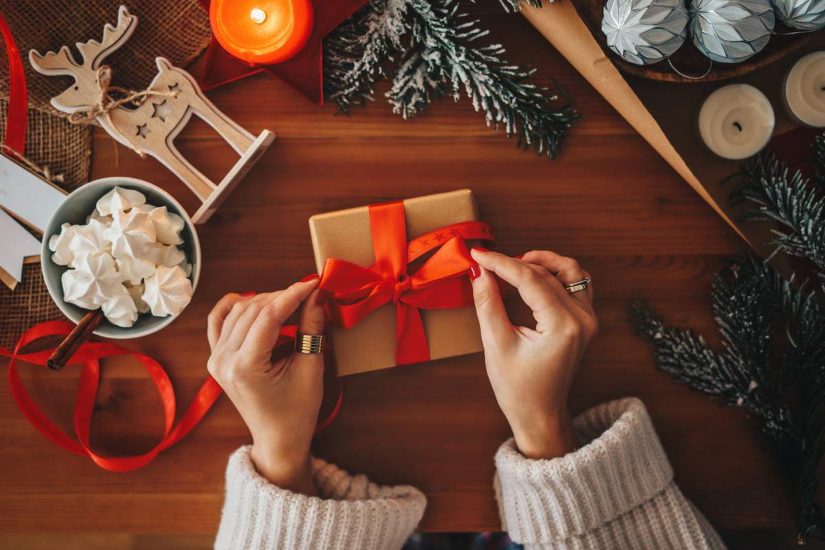 Woman wrapping Christmas gifts.