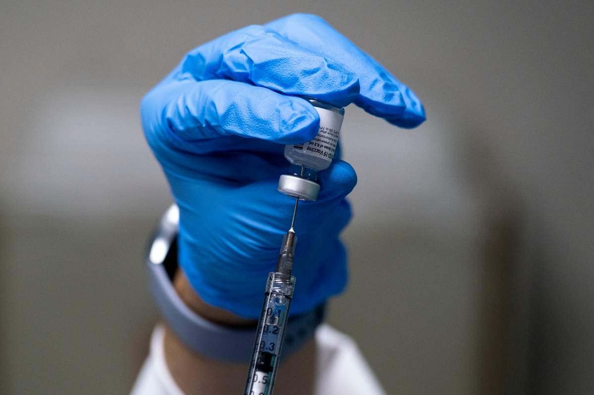 Occupational Nurse Melissa Valentin prepares a dose of Pfizer-BioNTech COVID-19 vaccine at the Ashford Medical Center in San Juan, Puerto Rico on Dec. 15, 2020.