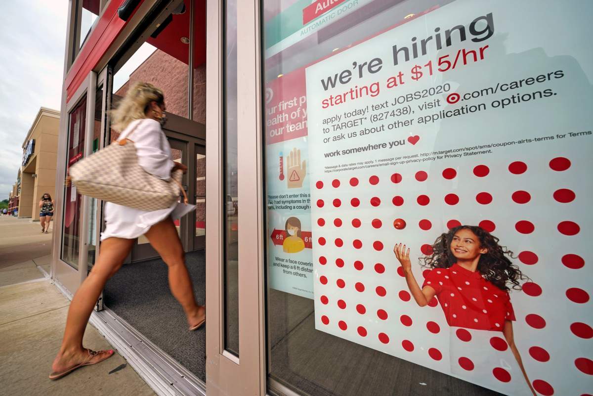 FILE - In this Sept. 2, 2020, file photo, a help wanted sign hangs on the door of a Target store in Uniontown, Pa. 
 (AP Photo/Gene J. Puskar, File).