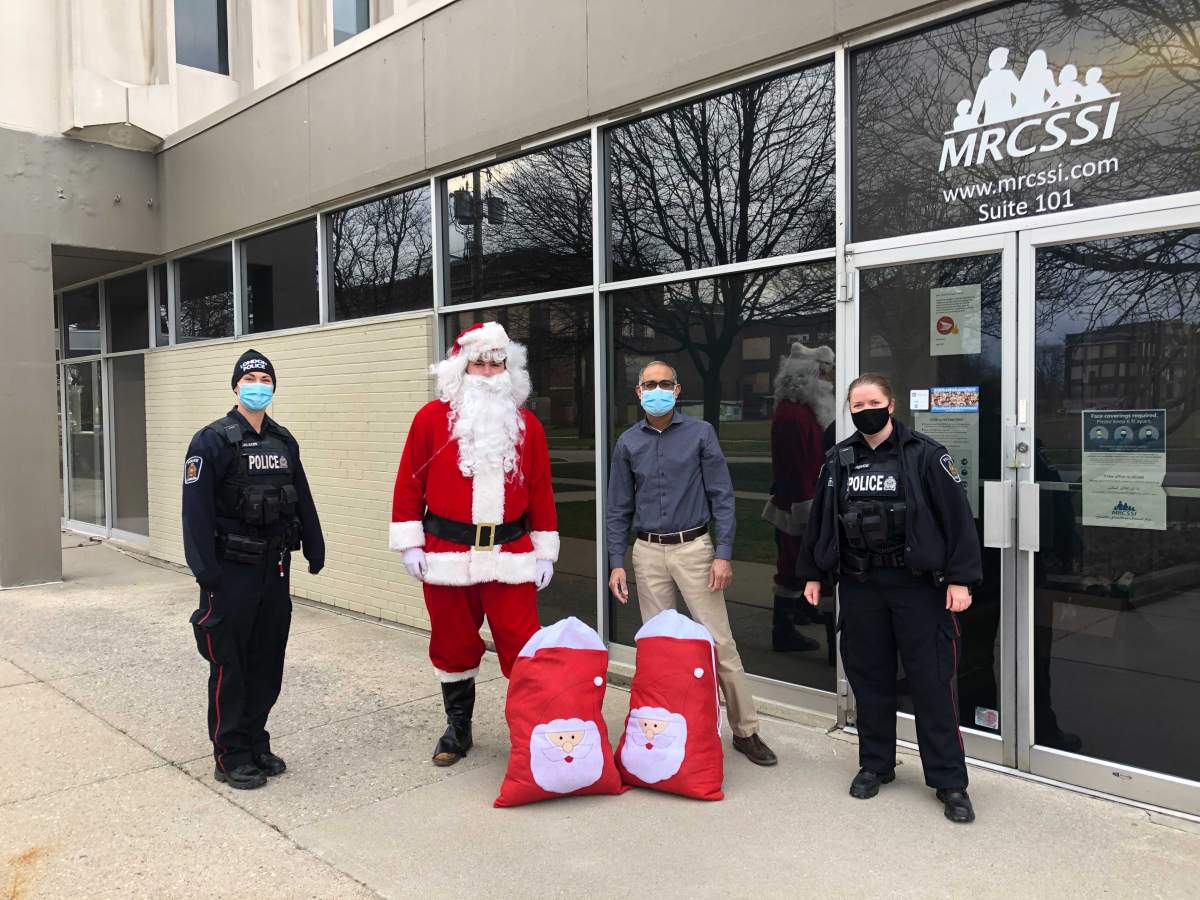 London police deliver winter items for children in need to the Muslim Resource Centre for Social Support & Integration (MRCSSI)