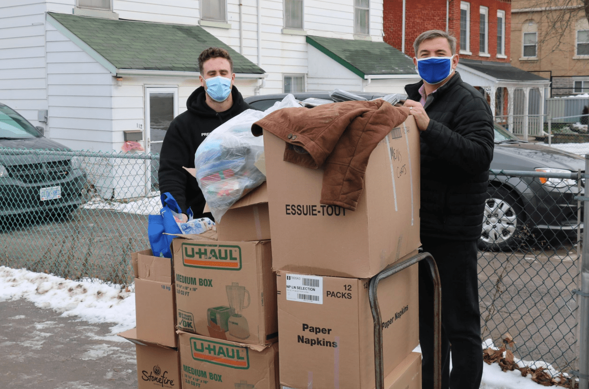 The Spread the Warmth campaign collected several thousand articles of clothing for shelters  in Peterborough, says MPP Dave Smith, right.