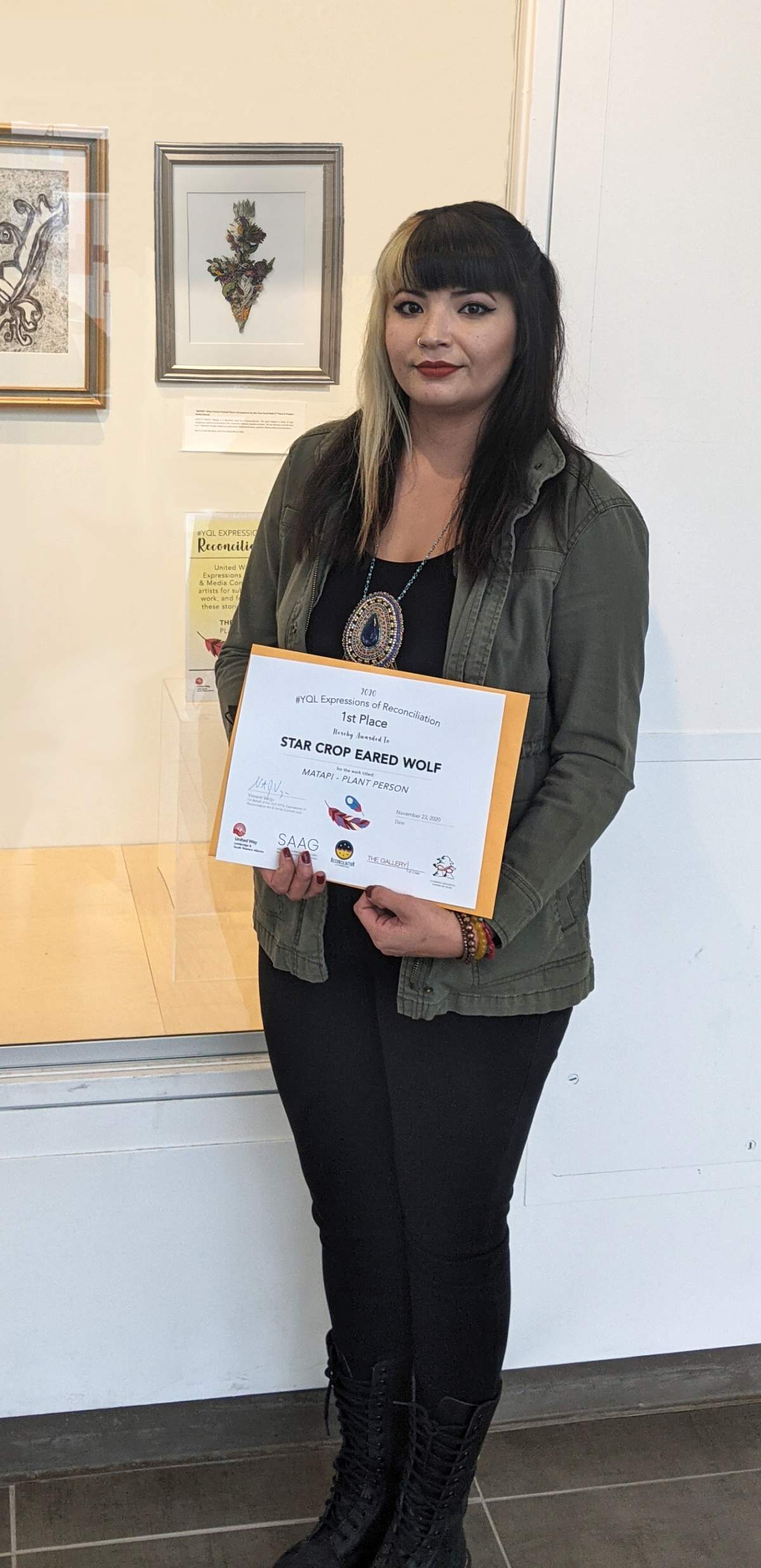 Star Crop Eared Wolf  wins first place and the People's Choice Award for the work titled “Matapi” – an arrangement of pressed flowers and plants.