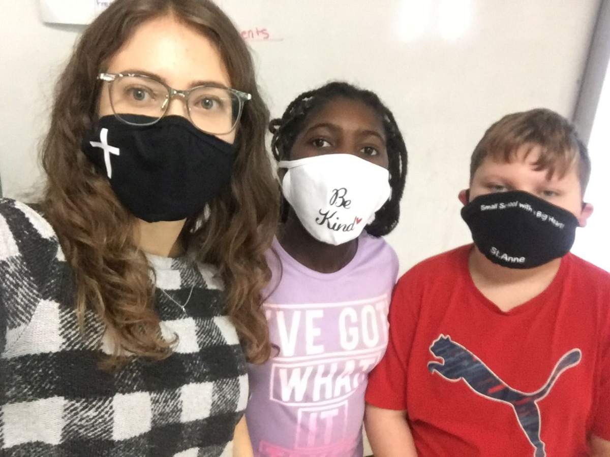Jill Johansen poses with students