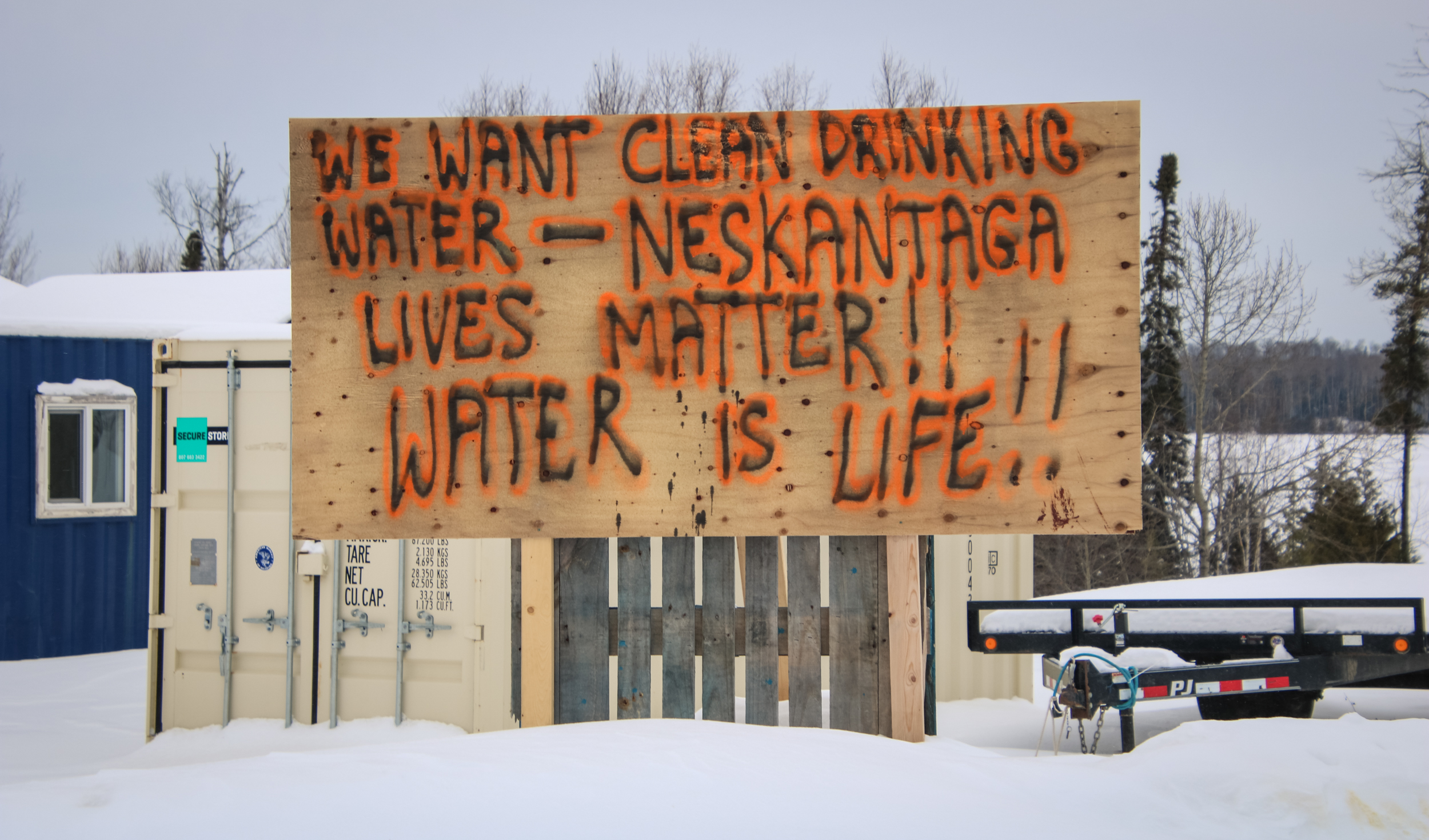 "We want clean drinking water. Neskantaga lives matter" sign.
