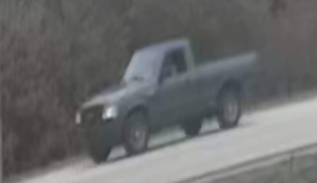 Police looking for an older model of a small silver sedan with a black rear bumper.