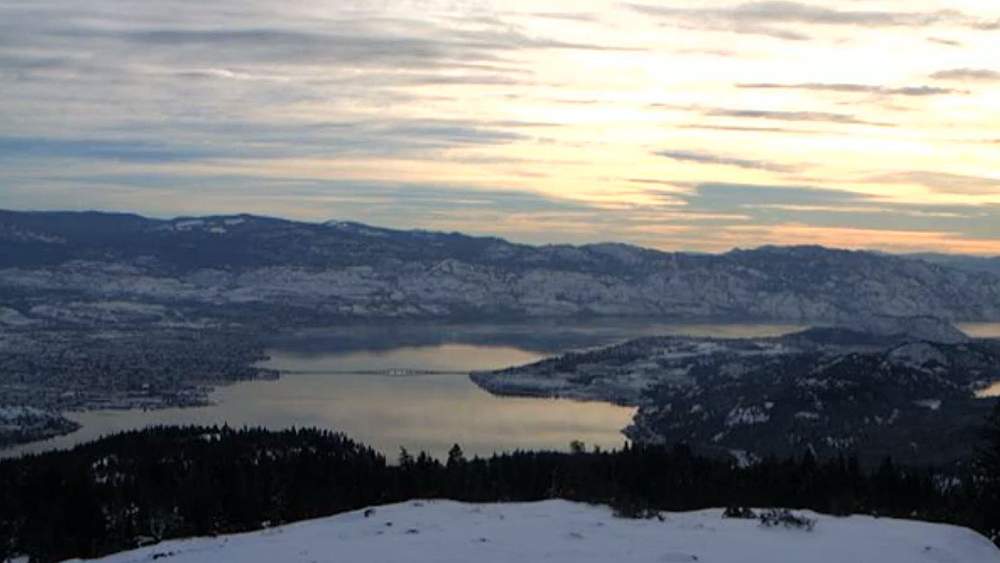FILE. A view of Okanagan Lake, Kelowna and West Kelowna. A Christmas Day storm set to hit the coast will likely bring some snow to the Okanagan by Boxing Day and beyond.
