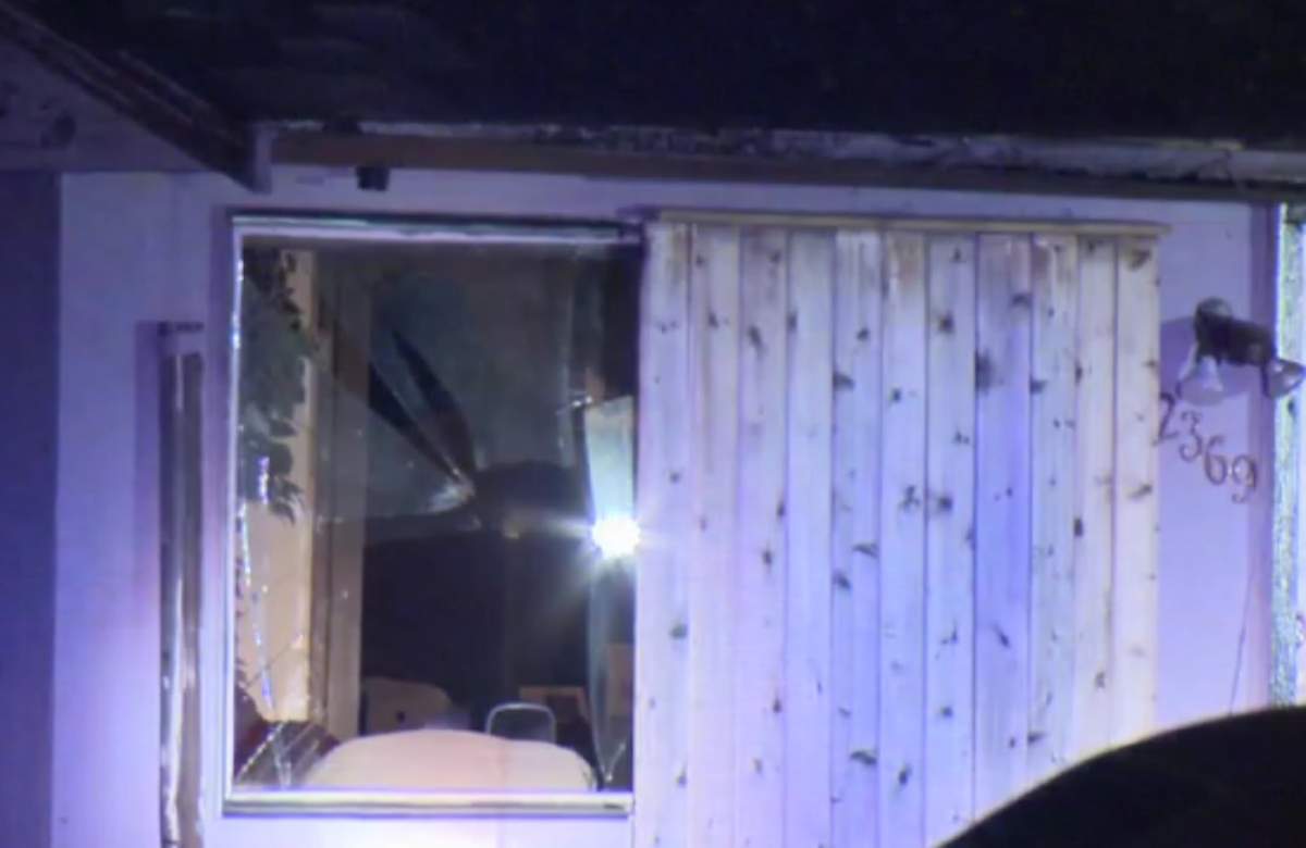 The front windows of the home located in the 2300 block of Clearbrook Road, apparently shot out.