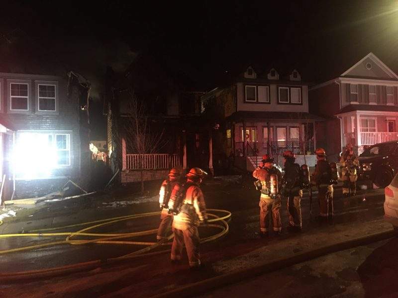 Calgary firefighters battle a blaze in Nolan Hill on Thursday, Dec. 3, 2020.