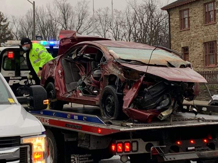 Police tow away a vehicle from the scene of a single-vehicle crash in Etobicoke on Sunday.