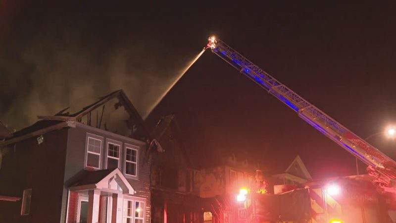 Calgary firefighters battle a blaze in Nolan Hill on Thursday, Dec. 3, 2020.
