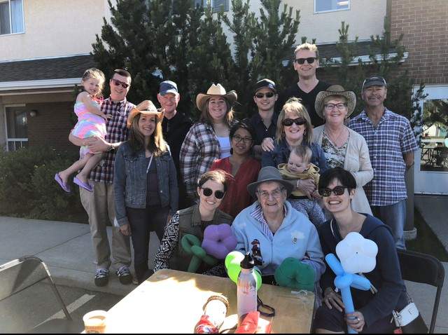 Grandma Rena surrounded by her family at a Stampede party.