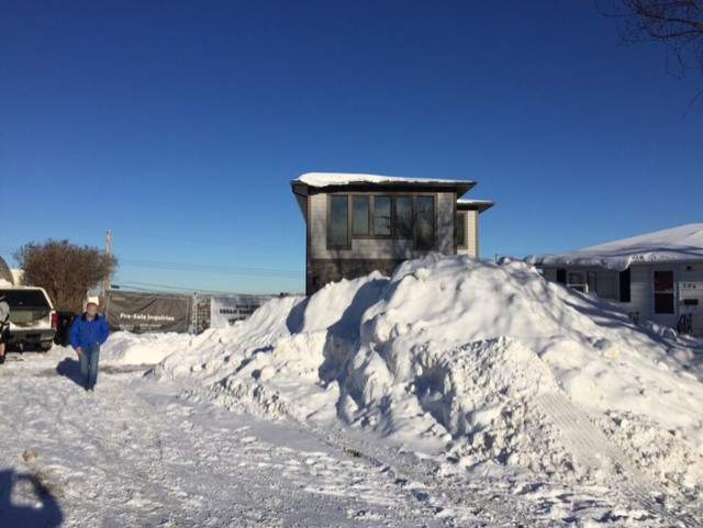 The snow pile is blocking the driveway and sidewalk of Garry Schmidt in N.E. Calgary.