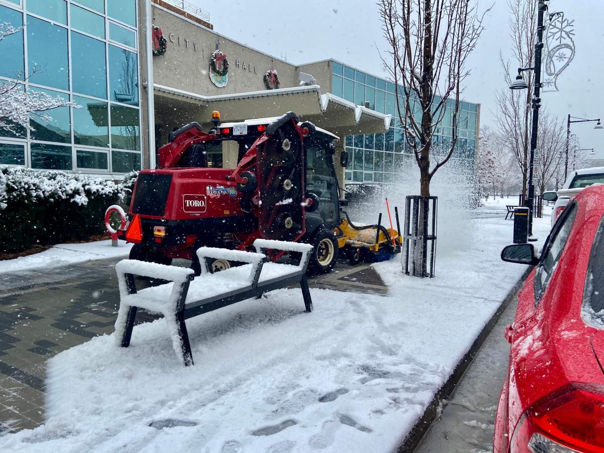 A snow removal crew clears city streets in Penticton, B.C., on Monday, Dec 21., 2020.