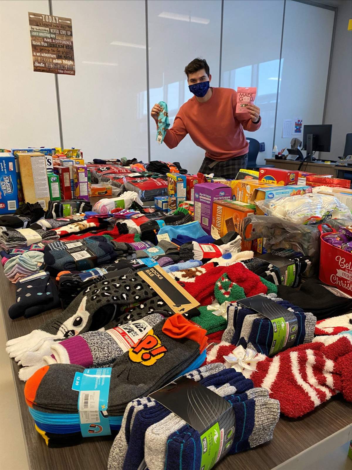A Southpointe School teacher poses in front of school donations