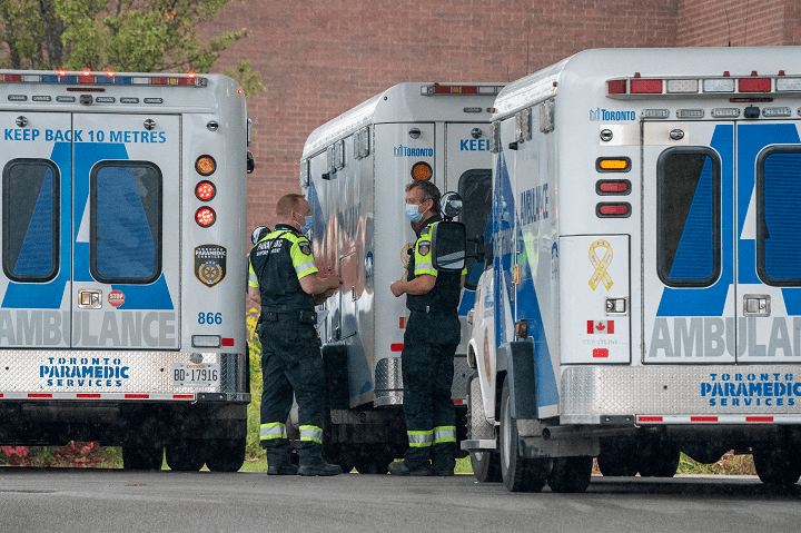 Paramedics stand by their ambulances at Toronto Western Hospital in Toronto on Tuesday October 27, 2020. 