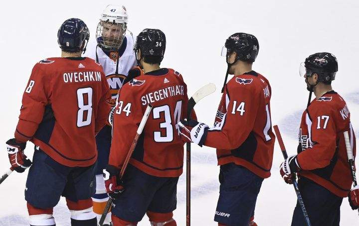 Washington Capitals left wing Alex Ovechkin (8) shakes hands with New York Islanders right wing Leo Komarov (47) after being eliminated during third period NHL Eastern Conference Stanley Cup playoff hockey action in Toronto on Thursday, August 20, 2020. 