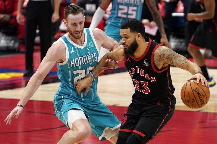 Toronto Raptors guard Fred VanVleet (23) works against Charlotte Hornets forward Gordon Hayward (20) during the first half of an NBA basketball game Saturday, Jan. 16, 2021, in Tampa, Fla. 