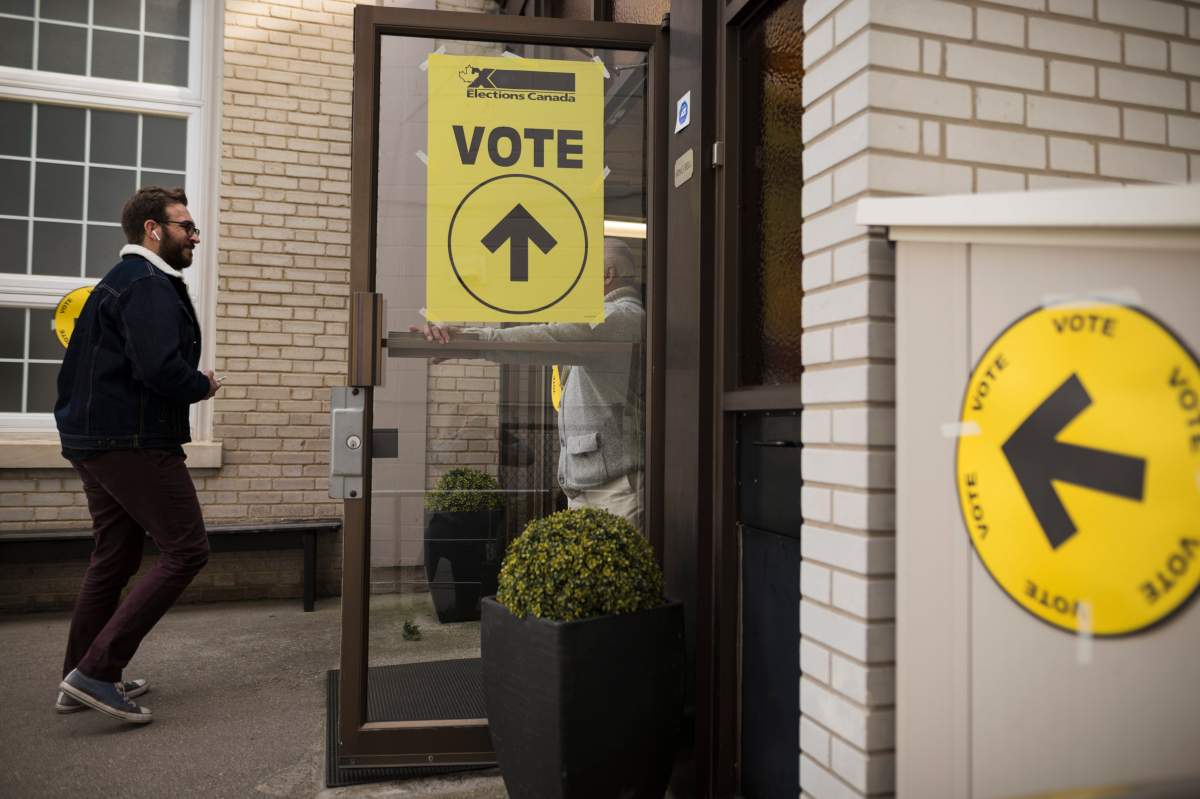 A voter makes their way towards the polling station at  West Toronto Baptist Church during election day in Toronto on Monday, Oct. 21, 2019. 