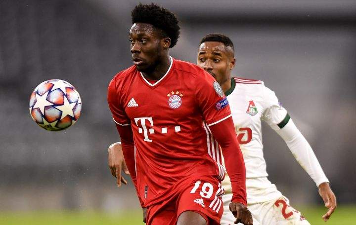 Alphonso Davies (L) of Bayern Munich in action against Francois Kamano (R) of Lokomotiv Moscow during the UEFA Champions League group A soccer match between Bayern Munich and Lokomotiv Moscow in Munich, Germany, 09 December 2020.  