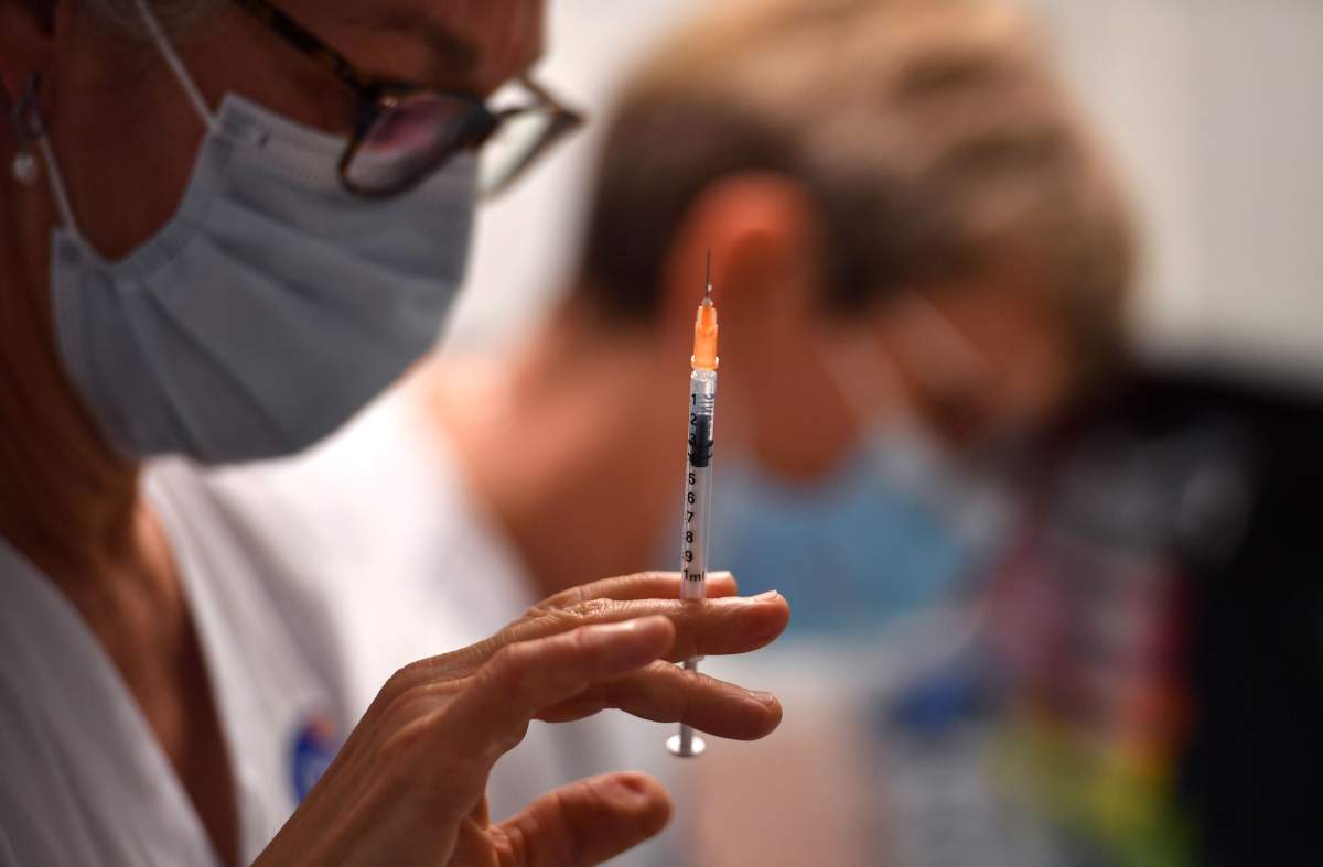 A nurse fills a syringe with the Pfizer-BioNtech coronavirus disease (Covid-19) vaccine on January 4, 2020 in the Bellevue gerontology center in Montpellier in the south of France. - French president faced on January 4, 2020 growing pressure to accelerate France's Covid-19 vaccination drive which has seen just a few hundred people receive the jab. (Photo by Pascal GUYOT / AFP) (Photo by PASCAL GUYOT/AFP via Getty Images).
