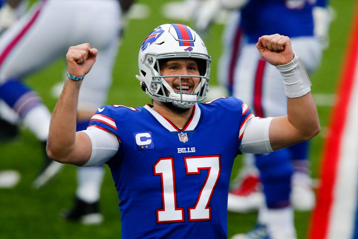 Buffalo Bills quarterback Josh Allen (17) reacts after throwing a touchdown pass in the first half of an NFL football game against the Miami Dolphins, Sunday, Jan. 3, 2021, in Orchard Park, N.Y. 