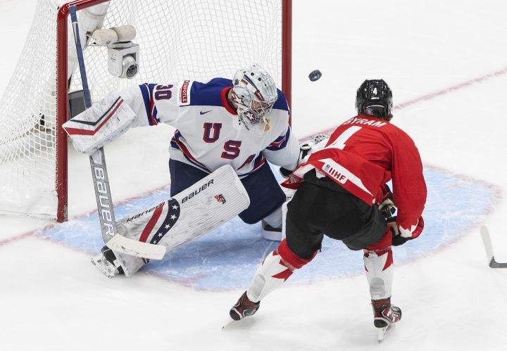 Canada’s Bowen Byram (4) is stopped by United States goalie Spencer Knight (30) during second period IIHF World Junior Hockey Championship gold medal game action in Edmonton on Tuesday, January 5, 2021.