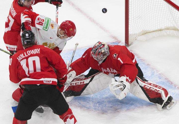 Canada goalie Devon Levi makes the save on Russia’s Ilya Safonov (24) during second period IIHF World Junior Hockey Championship action in Edmonton on Monday, January 4, 2021.