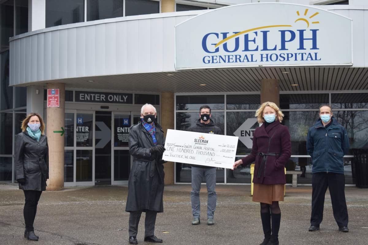 Sleeman Breweries presents a cheque for $100,000 to Guelph General Hospital. 