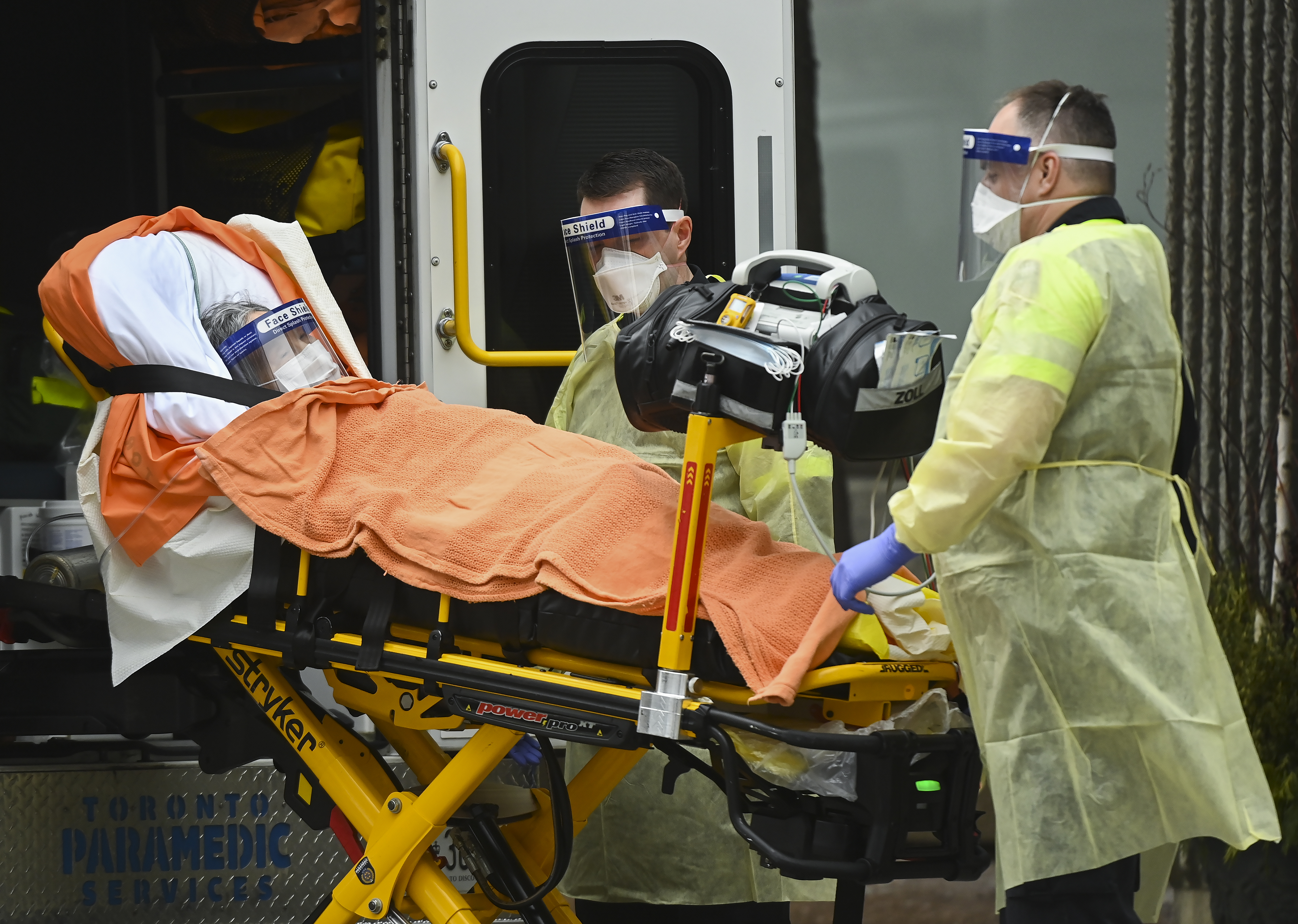 Paramedics take away an elderly patient at the Tendercare Living Centre, long-term-care facility during the COVID-19 pandemic in Scarborough, Ont., on Wednesday, December 23, 2020. Nearly half of its 254 residents along with 47 staff members so far have tested positive for the coronavirus. THE CANADIAN PRESS/Nathan Denette.