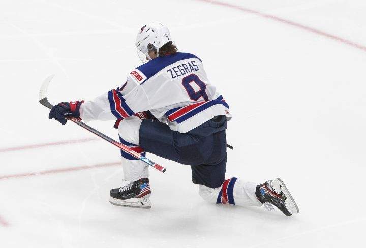 United States’ Trevor Zegras (9) celebrates a goal against Canada during second period IIHF World Junior Hockey Championship gold medal game action in Edmonton on Tuesday, January 5, 2021.