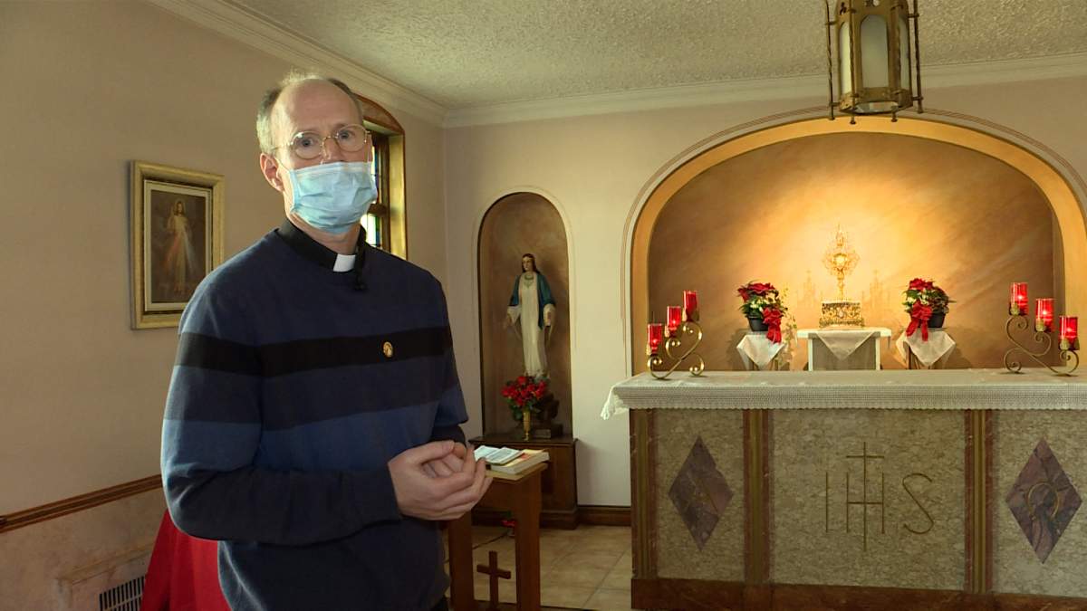 Fr. Mark Ruckpaul stands in the Adoration chapel at St. Michael the Archangel Catholic Church