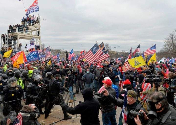 Trump supporters clash with police and security forces as they try to storm the U.S. Capitol in Washington, D.C. on January 6, 2021.