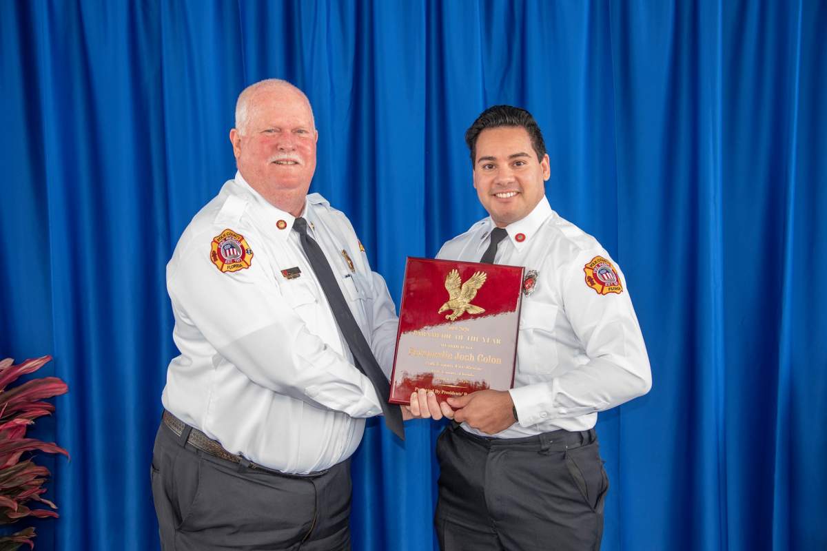 Joshua Colon, right, is shown with the Paramedic of the Year award in this photo posted Jan. 13, 2021.