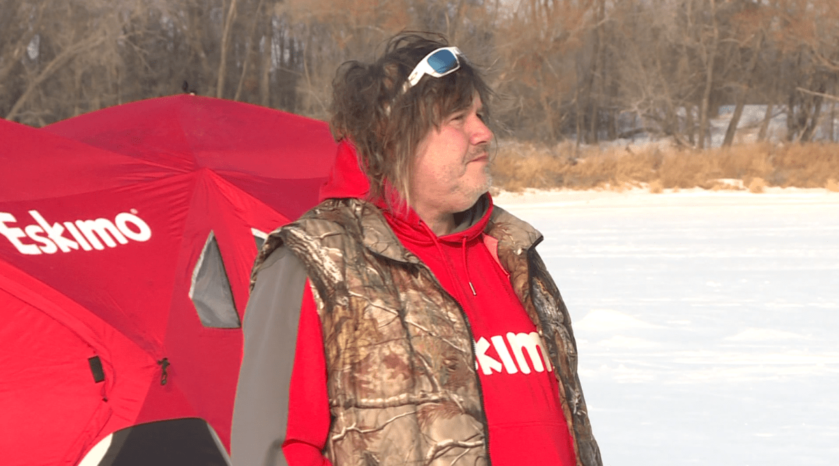Todd Longley, a professional fishing guide based in Winnipeg, inspecting the conditions on the Red River Sunday afternoon.