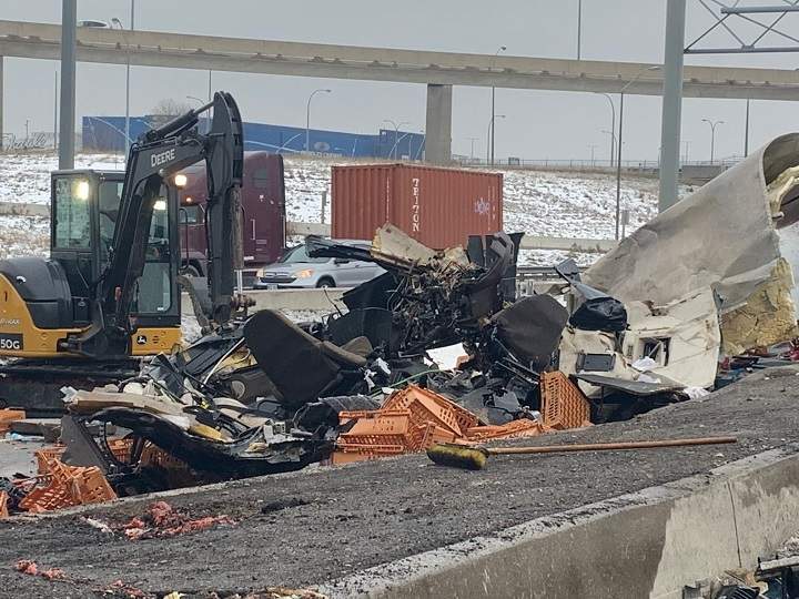 A photo of the cleanup efforts following a crash involving two transport trucks on Highway 401 in Toronto.