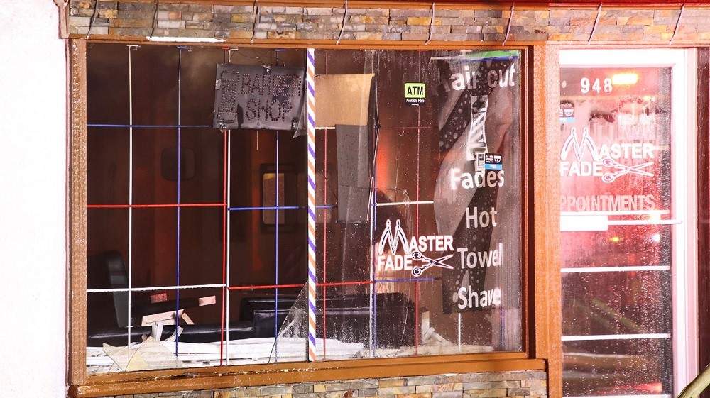 Fire damages stores in New Westminster Friday morning. Credit: Shane MacKichan.