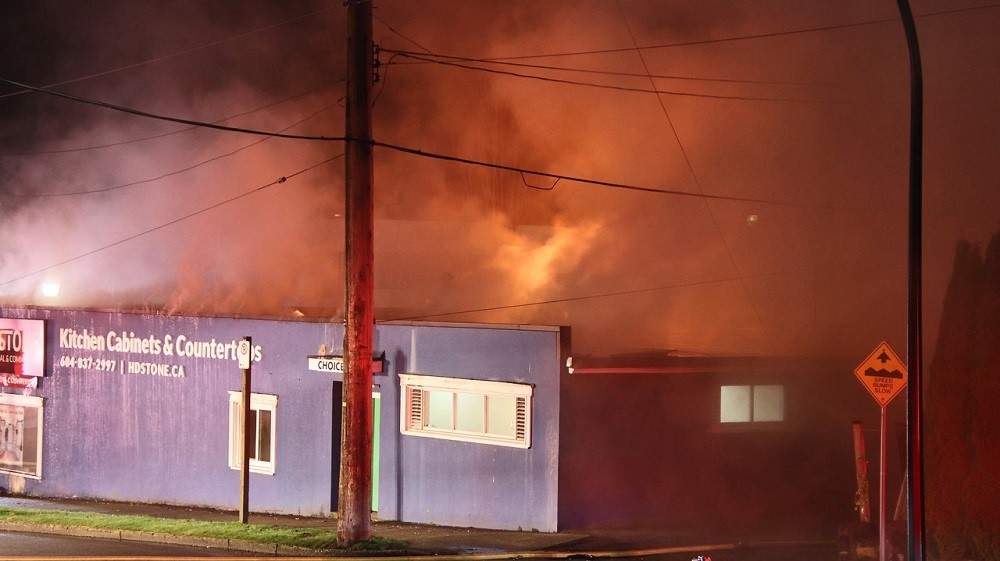 Fire damages stores in New Westminster Friday morning. Credit: Shane MacKichan.