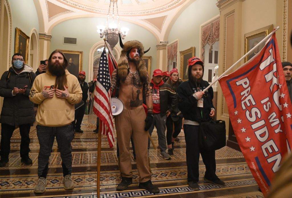Supporters of U.S. President Donald Trump, including member of the QAnon conspiracy group Jacob Chansley, a.k.a. Yellowstone Wolf (centre), enter the U.S. Capitol on Jan. 6, 2021, in Washington, D.C.
